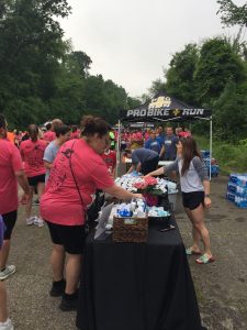 Kittridge Dermatology staff handing out water to participants of the Pittsburgh Melanoma Foundation's 8th annual 5K run/walk.